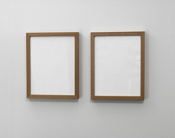 Invisible Art: Two picture frames containing blank white paper