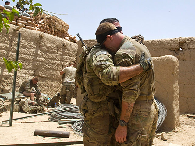 Picture Desk Live: US Army soldiers comfort each other