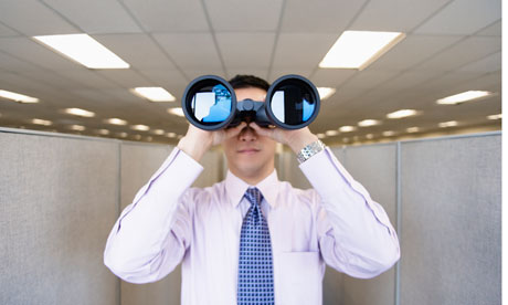 office worker with binoculars