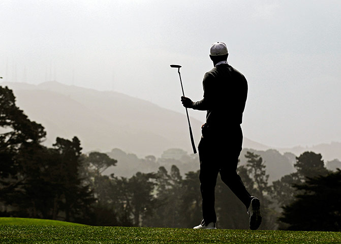 Picture desk Live: Tiger Woods walks off the 17th green