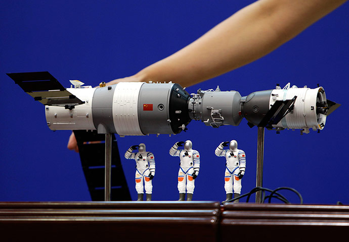 Picture desk Live: A model of the Shenzhou-9 manned spacecraft 