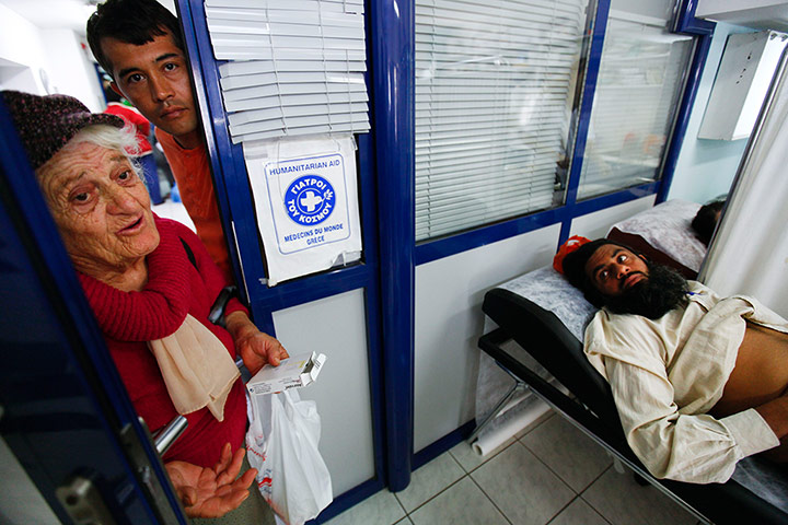 Greece: health system: Patients ask for help inside a medical centre