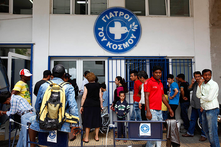 Greece: health system: Patients wait in front of a medical centre 