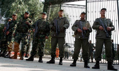 Tunisian soldiers stand guard outside the national assembly
