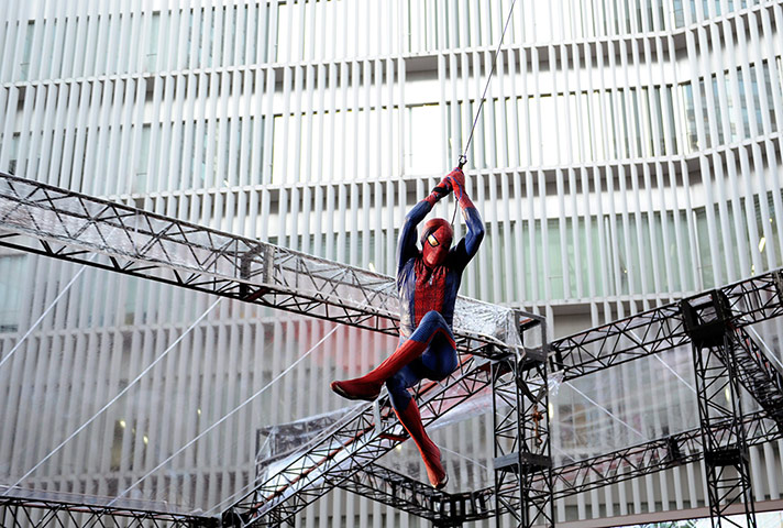 week in film: A man wearing the Spider-Man costume performs at the film's world premiere