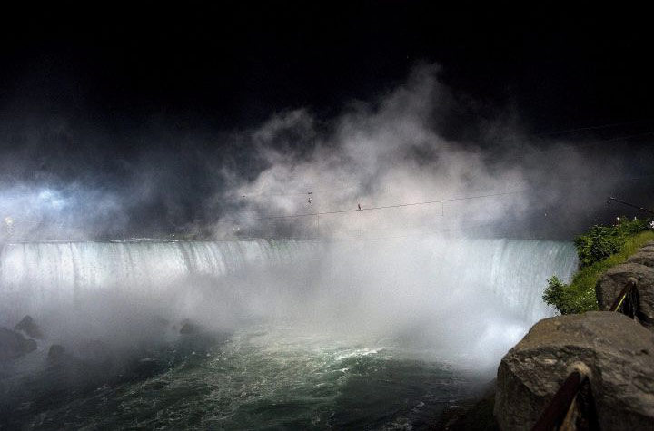 niagara falls tightrope: Nik Wallenda in the spray and mist of Niagara Falls