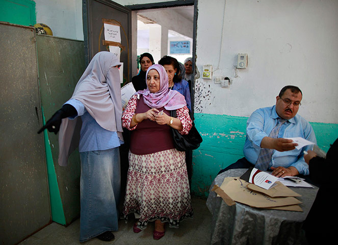 Egypt elections: A woman enters a polling station
