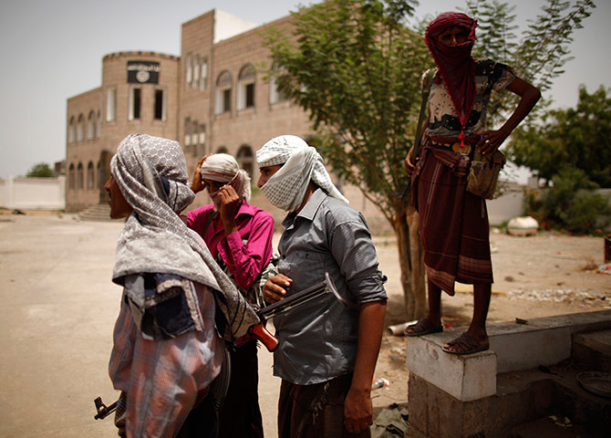 24 Hours: Pro-army tribesmen guard a building used by al Qaeda-linked militants
