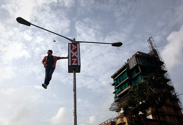 24 Hours: Magician and illusionist Cyril Takayama on a roadside light in India