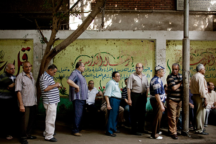 Egypt elections day 2: Egyptian men line up to vote in the Shobra neighborhood of Cairo