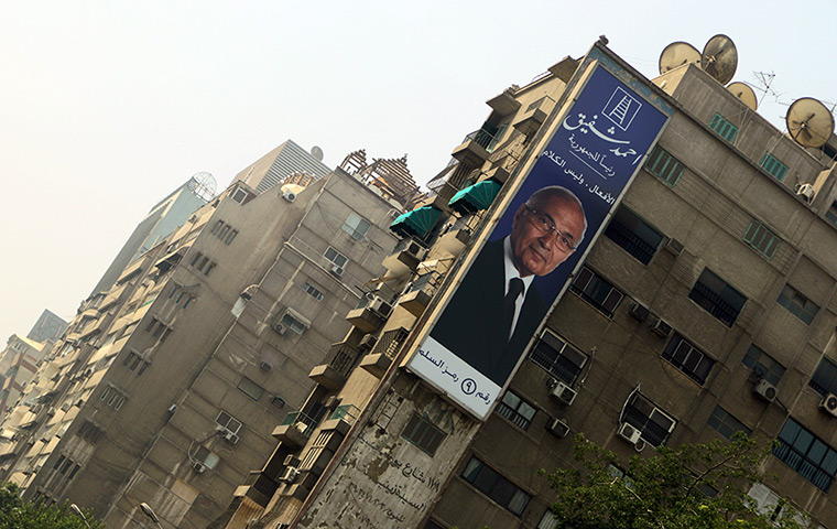 Egypt elections day 2: A poster of presidential candidate Ahmed Shafiq on a building in Cairo 