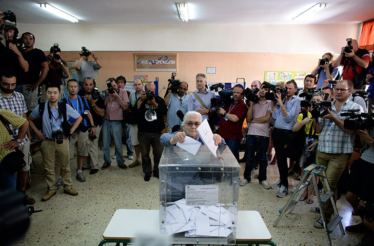 Greeks vote: An elderly woman casts her vote at a polling station in Athens