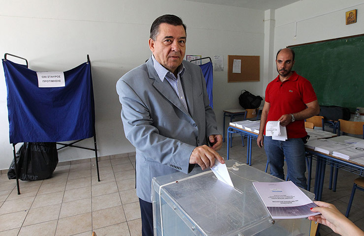 Greeks vote: Yorgos Karatzaferis casts his ballot in a polling station in Athens