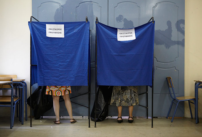 Greeks vote: Voters mark their ballots in a school-turned polling station in Athens