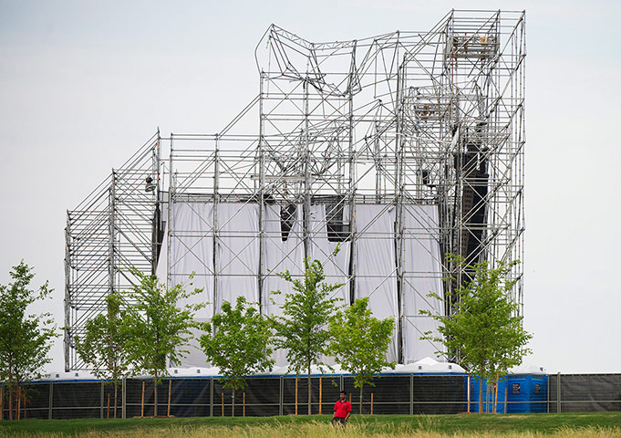 Week in music: A man stands near the collapsed stage at Downsview Park in Toronto