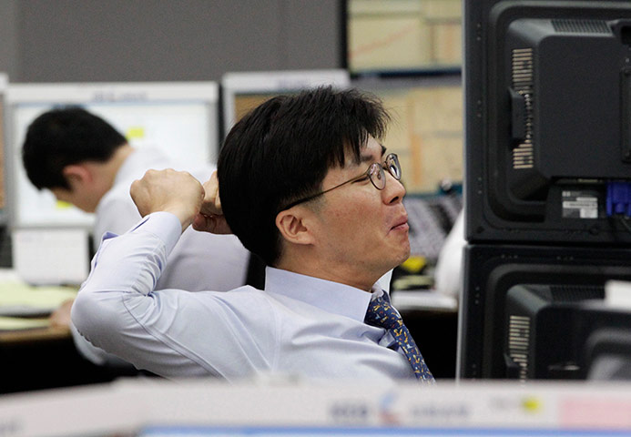 Picture desk live: A currency trader