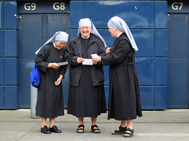 24 hours in pictures: Catholic nuns laugh as they attend 50th International Eucharistic Congress