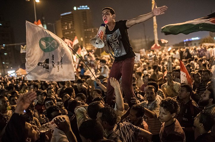 24 hours in pictures: Egyptians supporters of the Muslim Brotherhood celebrate premature victory