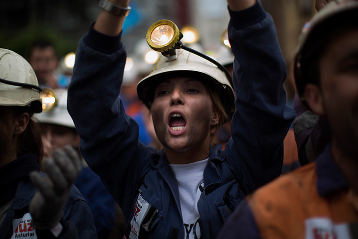 24 hours in pictures: Coal miner Shaila Hidalgo shouts slogans in a protest march