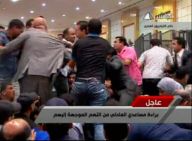 Mubarak Verdict: People scuffle in a courtroom in Cairo after the Mubarak verdict