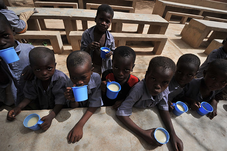 24 Hours: Children eat a meal at the Friendship Primary school in Zinder, Niger