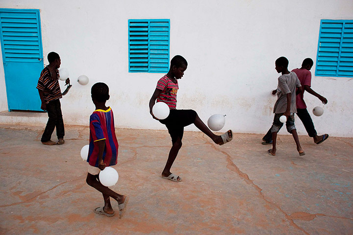 24 Hours: Boys with balloons after attending a dance recital in Mauritania