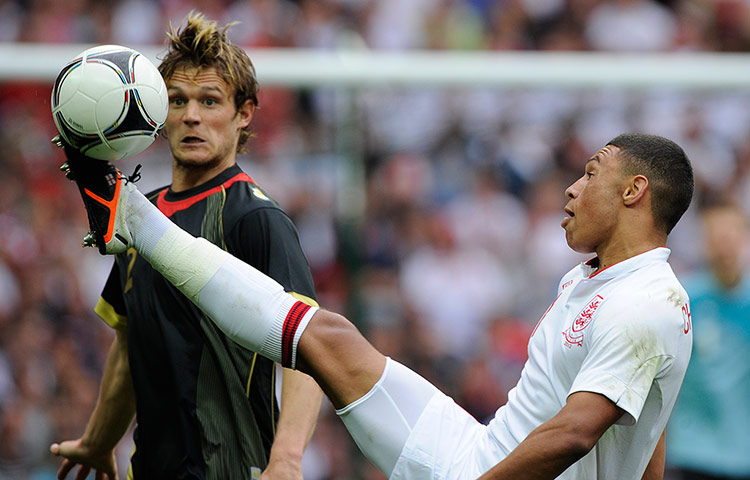 ENGLAND V BELGIUM: Alex Oxlade-Chamberlain controls the ball before Guillame Gillet