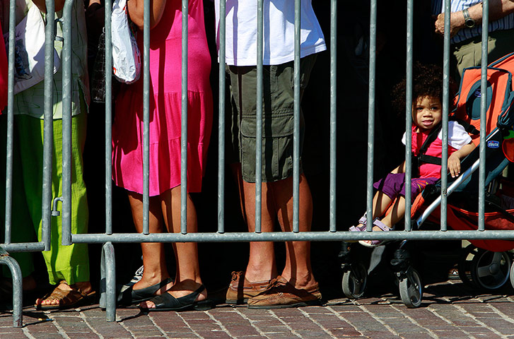 Picture desk live: People wait in line to receive free vegetables