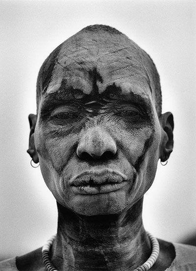 Sebastiao Salgado: Dinka man, skin covered with ash from cowpats, to protect against insects