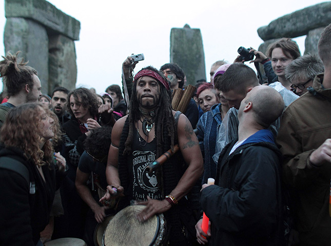 summer solstice: revellers  at stonehenge