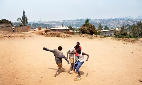 Boys play football in Rwanda