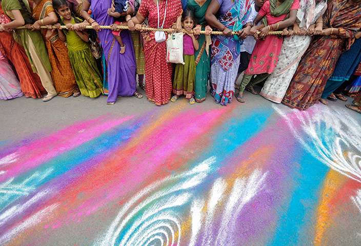 24 hours in pictures: Hindu devotees pull the rope of a Rath 