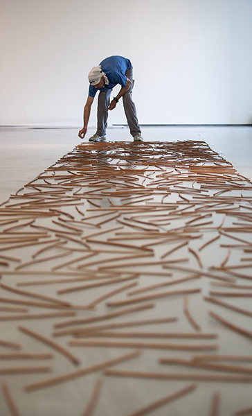 Richard Long : Richard Long laying out sticks at The Hepworth