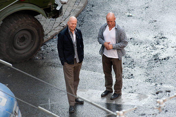 week in film : Bruce Willis and his body double chat on the set for A Good Day to Die Hard