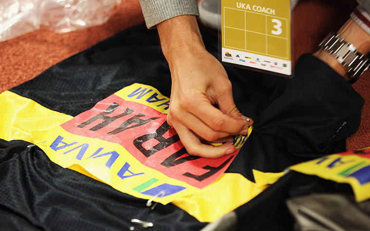 Athletics: Mo Farah's coach prepares his jersey ahead of his 1500m heat