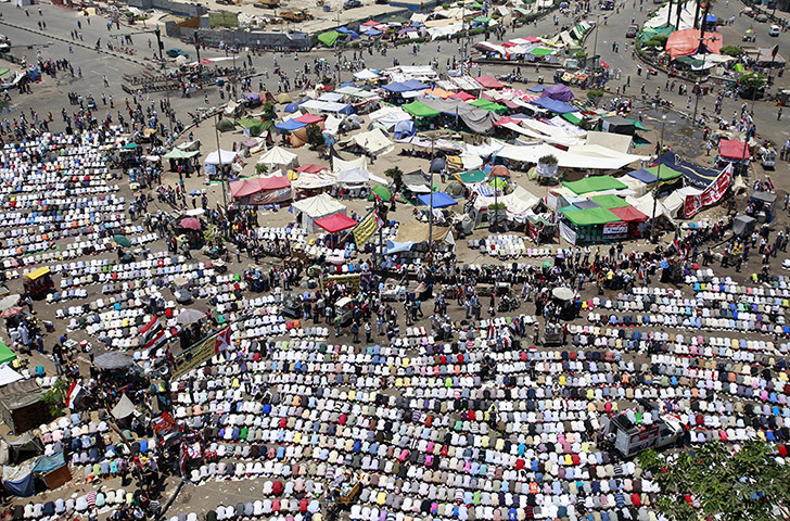 Egypt: Supporters of Mohamed Morsi perform the noon prayer