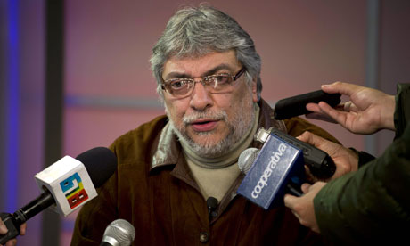 Ousted Paraguayan president Fernando Lugo speaks into a microphone