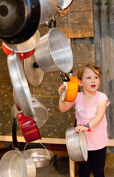Southbank: A child plays with pots at the Southbank's Festival of the World