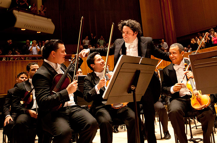 Southbank: Gustavo Dudamel congratulates violinists at the end of his concert