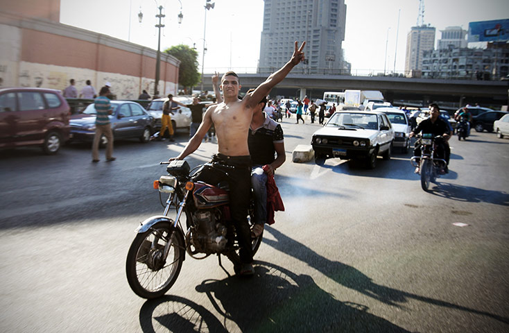 Egypt election results: A jubilant Egyptian makes the victory sign