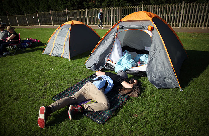 Picture desk live: A tennis fan camps out to get a ticket