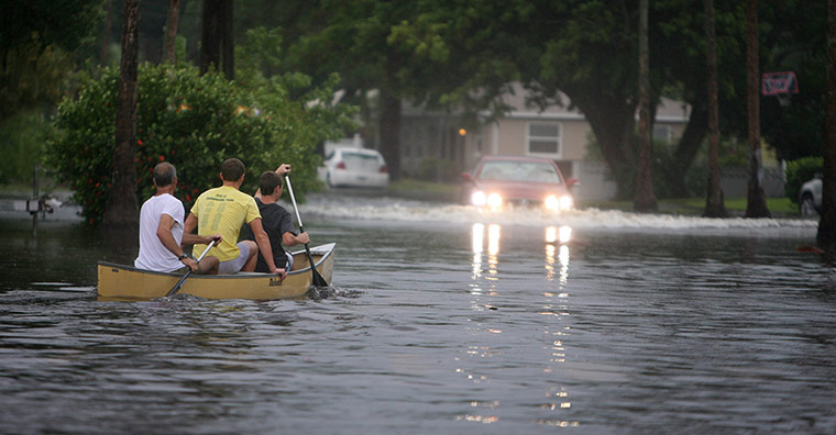 Picture desk live: Residents using a canoe