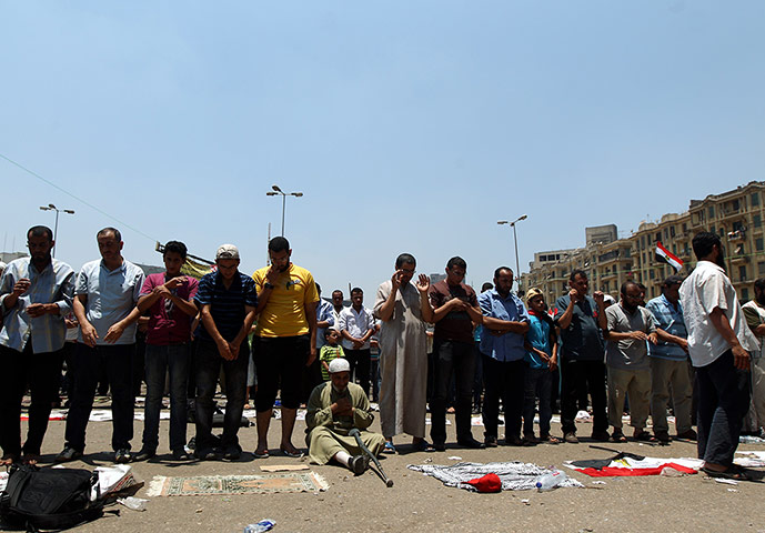 Picture desk live: Noon prayers in Tahir Square