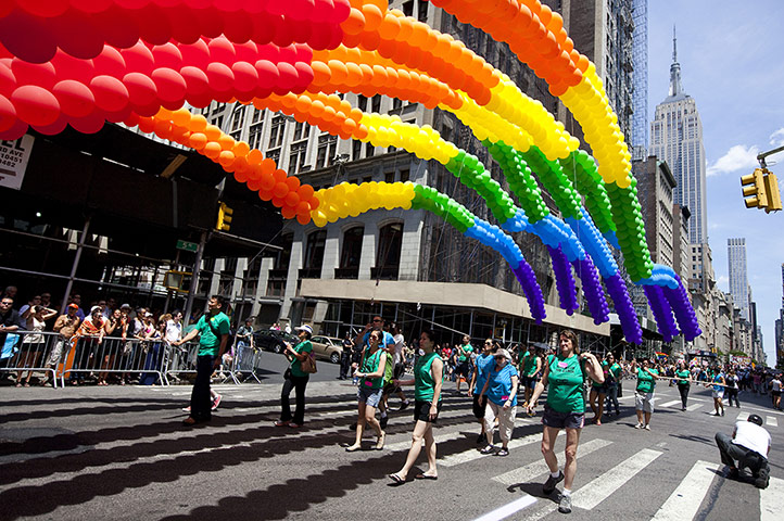 Gay pride week: New York, US: Rainbow balloons make their way down Fifth Avenue