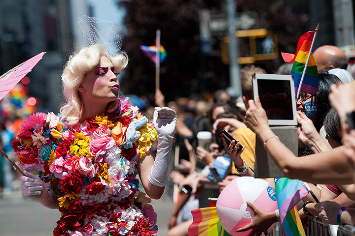 Gay pride week: New York, US: A marcher blows kisses to people in the crowd