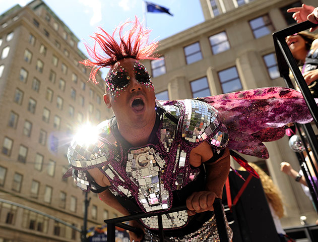 Gay pride week: New York, US: A marcher rides down Fifth Avenue
