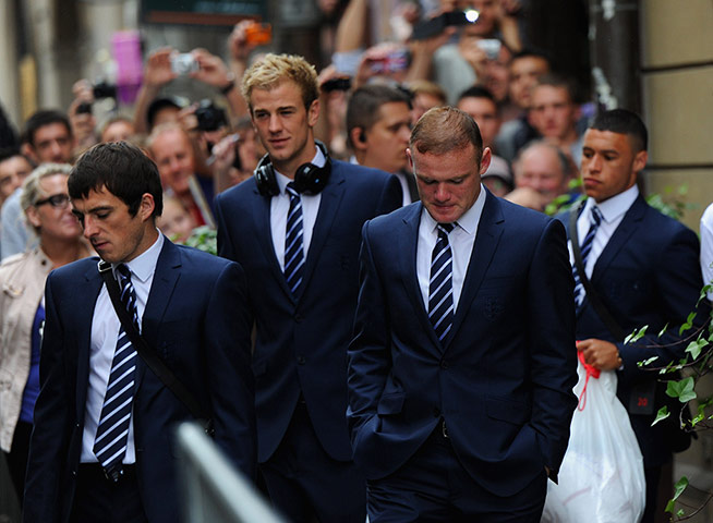 Picture desk live update1: England team members board the team bus in Krakow