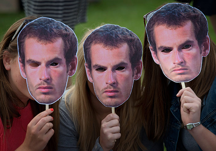Picture Desk Live: Tennis fans pose for pictures with masks
