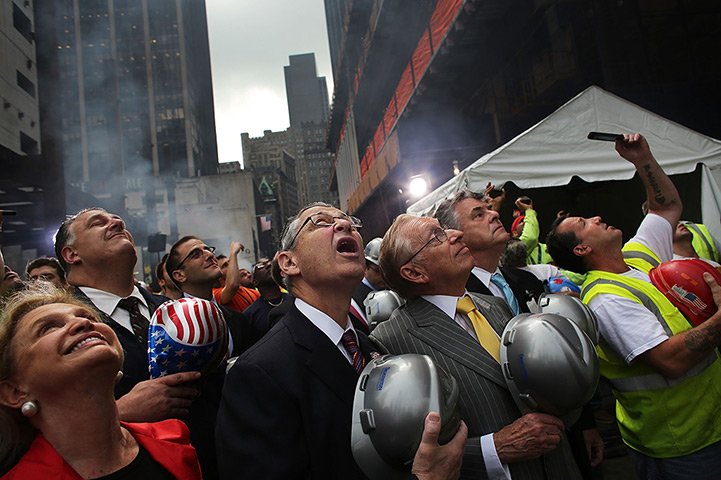 24 hours in pictures: Last steel beam is hoisted 977 feet to the top of Four World Trade Centre