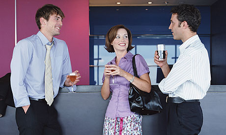 Three business people with drinks